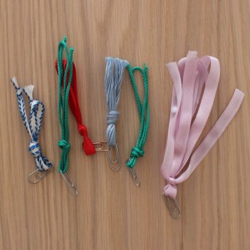 Make bookmarks out of paper clips and ribbons with your kid