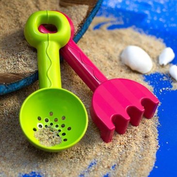 Play with a sieve in the sandbox