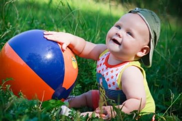 Offer your toddler to play with a big inflatable ball