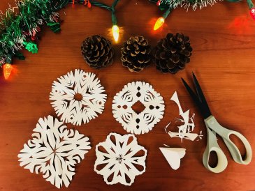 Decorate windows with snowflakes