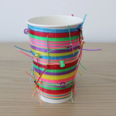 Activity picture for Decorate a cup with colored fishing line in Wachanga