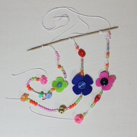 Activity picture for Make a pretty pendant with beads and buttons! in Wachanga