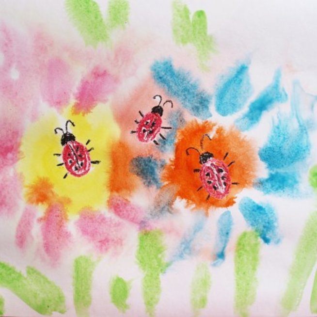 Draw little ladybugs on a flower meadow with your kid
