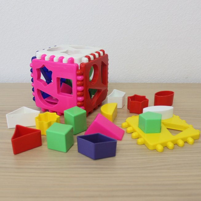 Play with a developing toy for sorting objects