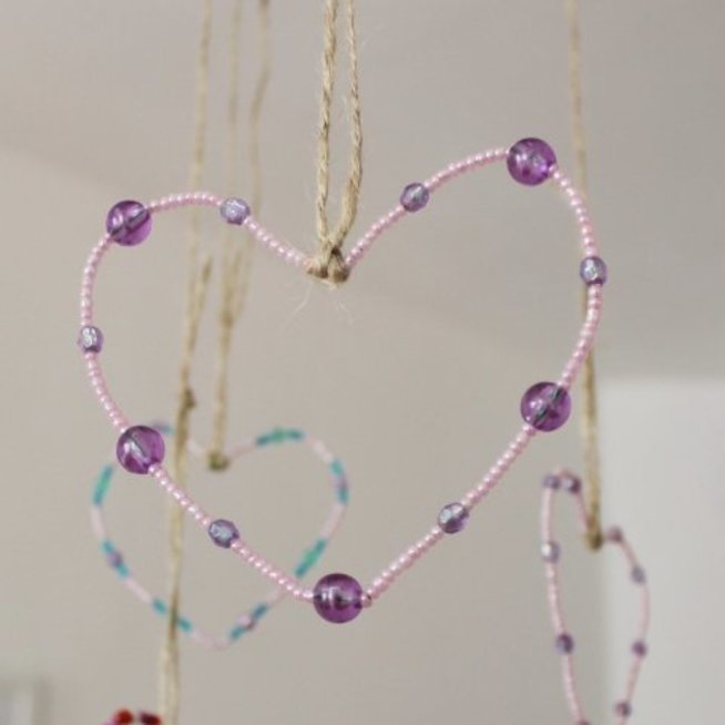 Make hearts out of beads with your kid 